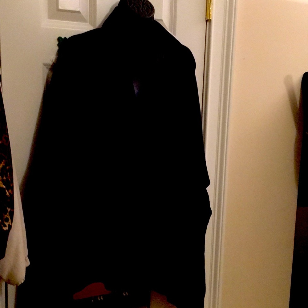 Chico’s reversible “Ruana” travel wrap in Grey and black.